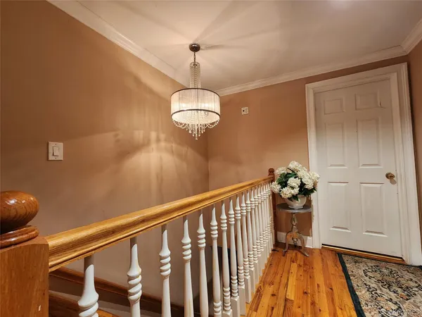 a view of a balcony with wooden floor