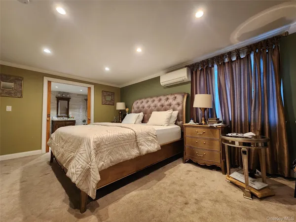 a bedroom with a bed and cabinets
