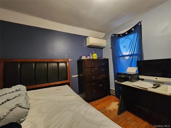 a bedroom with a bed and a closet