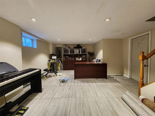 a room with wooden floor and furniture