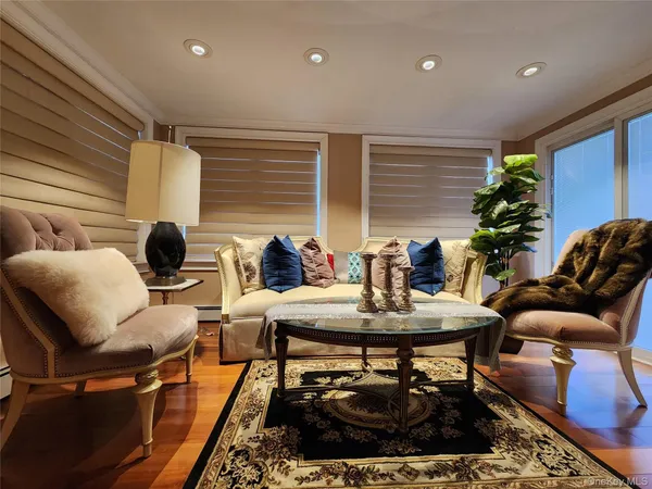 a work room with furniture and wooden floor