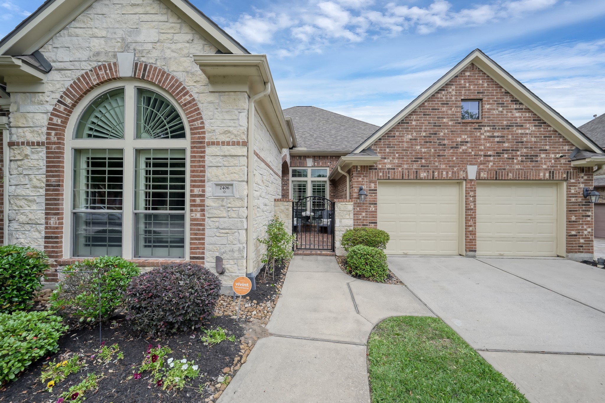 2406 Randal Point Court Spring, TX 77388 - Photo 3 of 45 Large arched windows with stone accent.