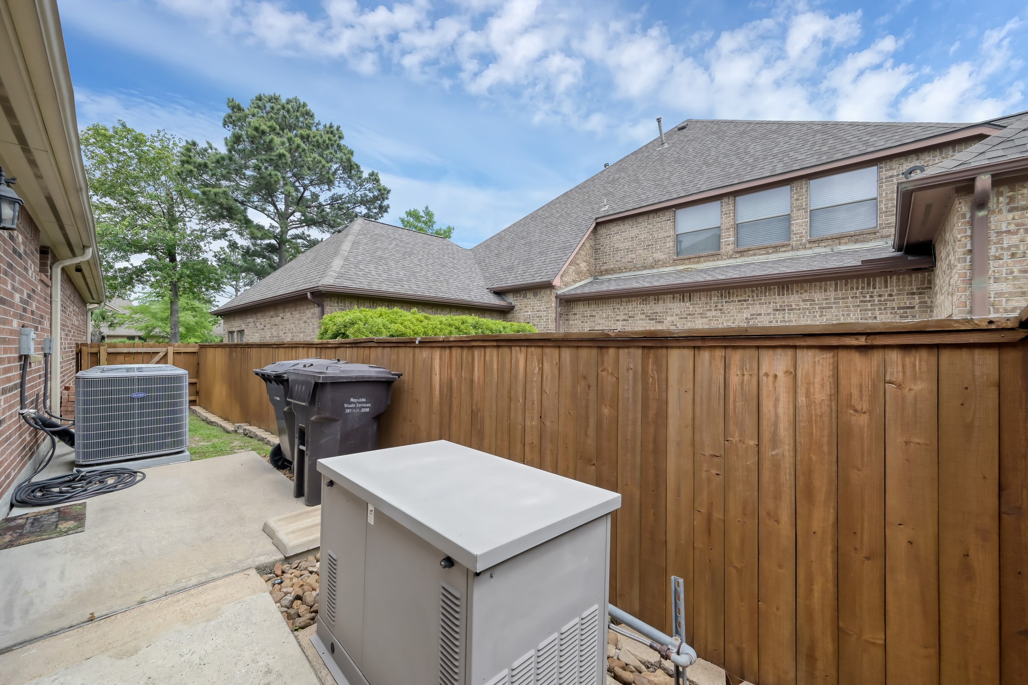 2406 Randal Point Court Spring, TX 77388 - Photo 40 of 45 Generator on side yard behind the privacy fencing.