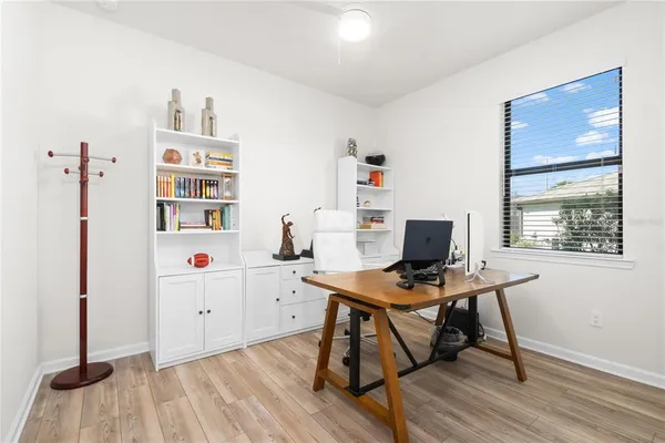 a workspace with furniture and window