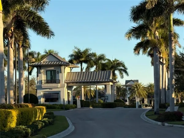 a front view of a house with a garden and a yard