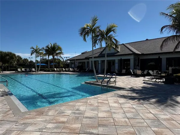 a view of a chairs and tables in the patio