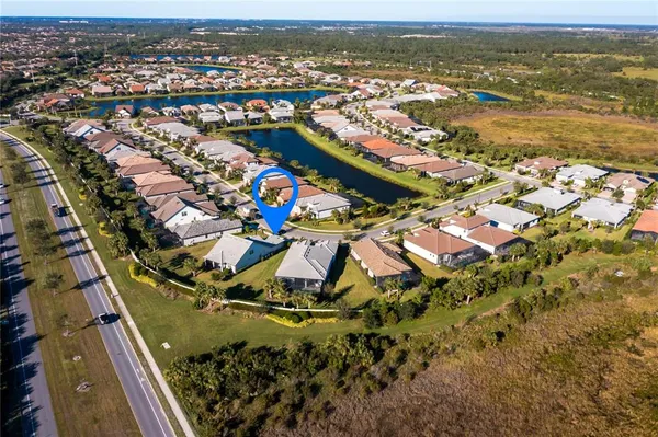 an aerial view of residential houses with outdoor space