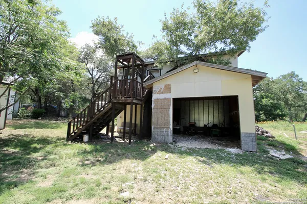 a house with trees in the background