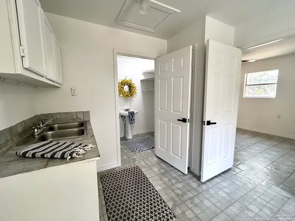 a kitchen with a refrigerator stove and cabinets