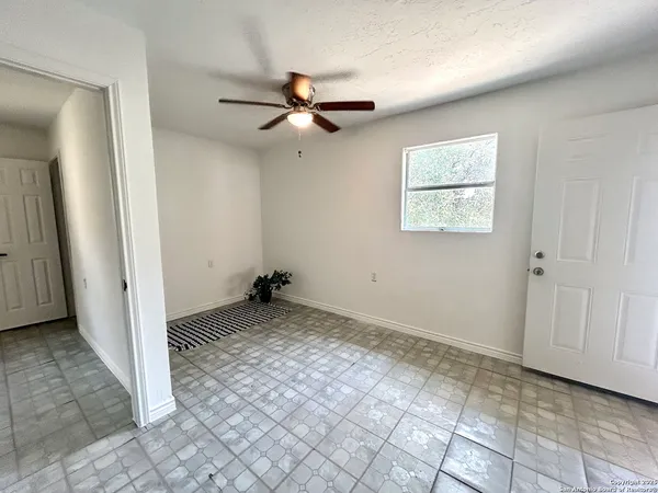 a view of an empty room and window