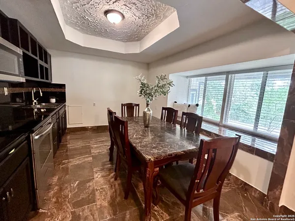 a view of a dining room with furniture