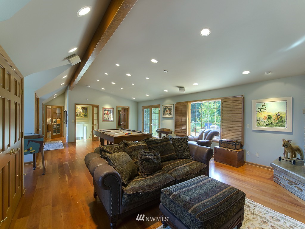 21800 Nootka Road Woodway, WA 98020 - Photo 12 of 15 a living room with furniture and a wooden floor
