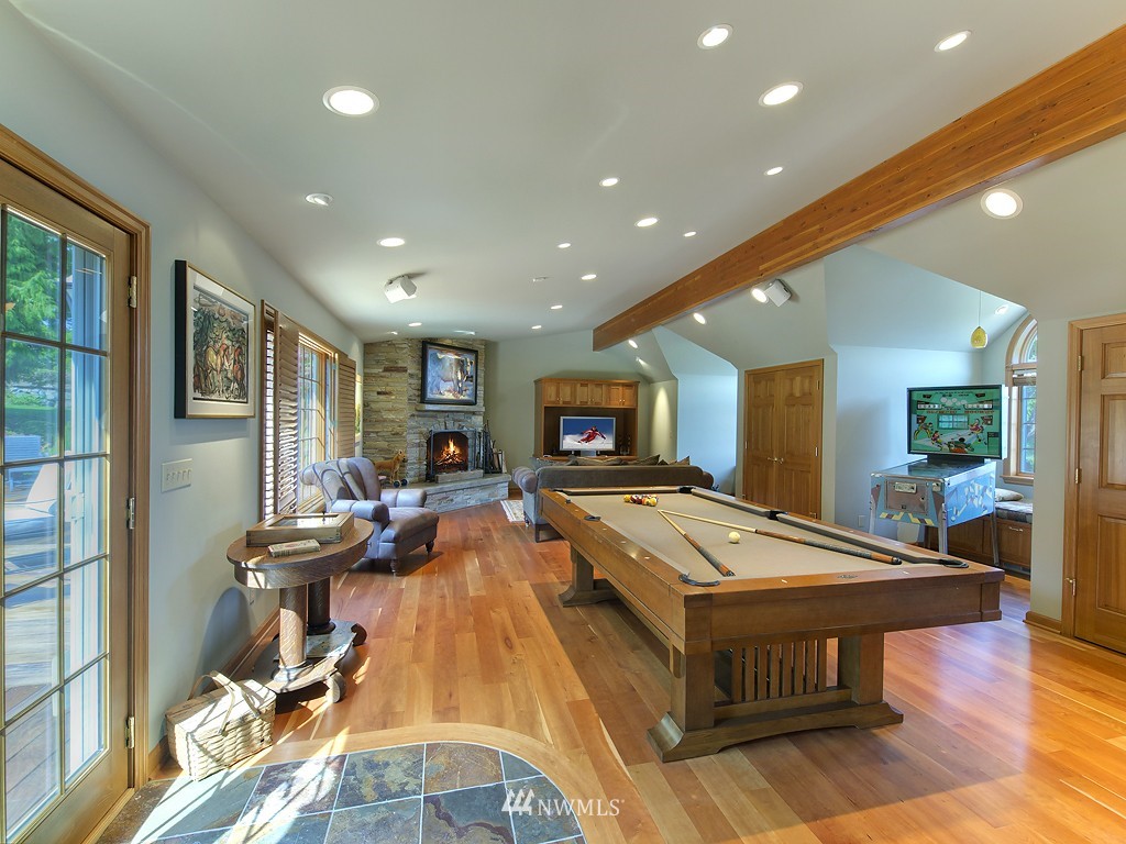 21800 Nootka Road Woodway, WA 98020 - Photo 13 of 15 a living room with furniture pool table and a flat screen tv