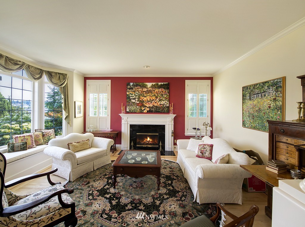 21800 Nootka Road Woodway, WA 98020 - Photo 4 of 15 a living room with furniture fireplace and a large window