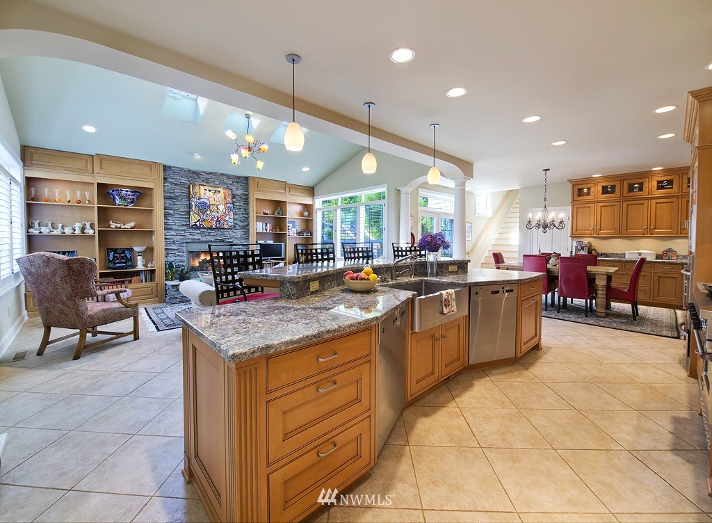 21800 Nootka Road Woodway, WA 98020 - Photo 6 of 15 a kitchen with lots of counter furniture and a view of living room