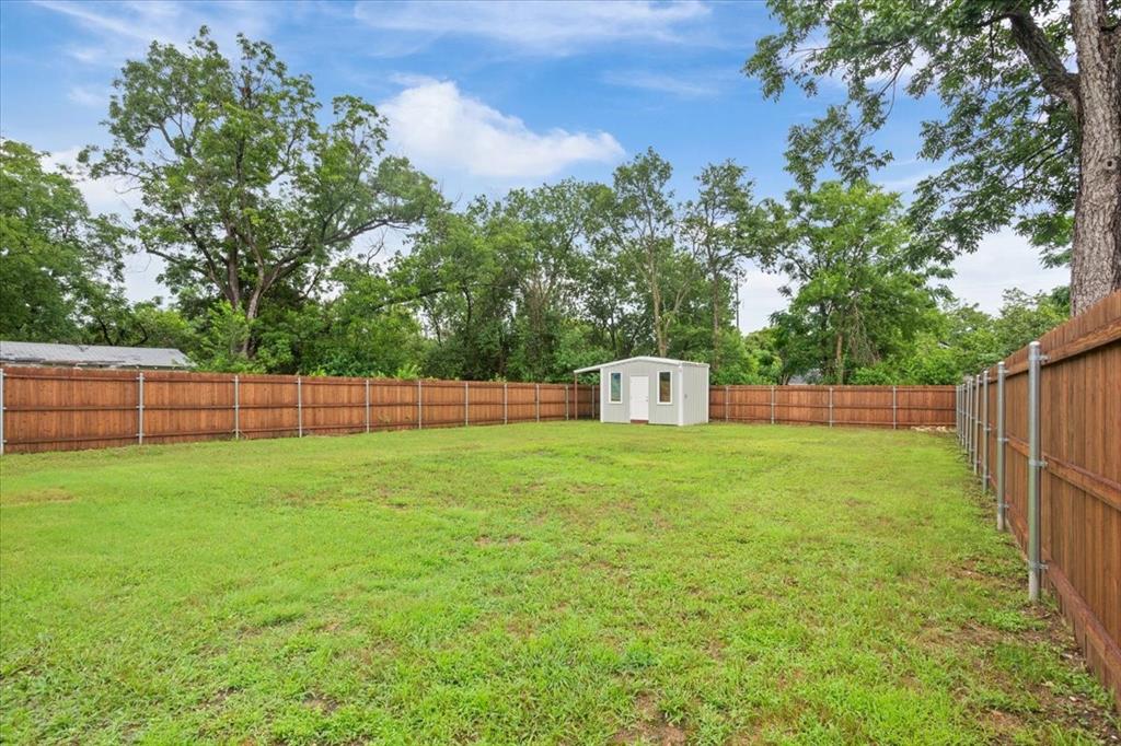 Undisclosed Address Waco, TX 76708 - Photo 30 of 30 Fenced backyard with a storage shed
