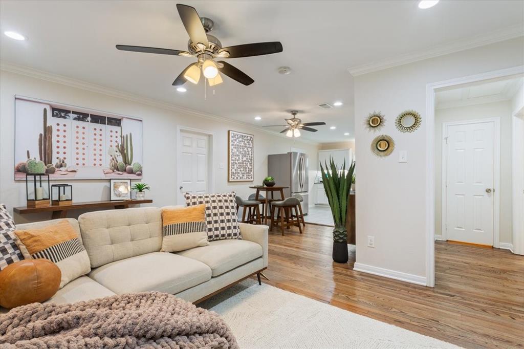 Undisclosed Address Waco, TX 76708 - Photo 10 of 30 Living room with recessed lighting, light wood-style floors, ceiling fan, and crown molding