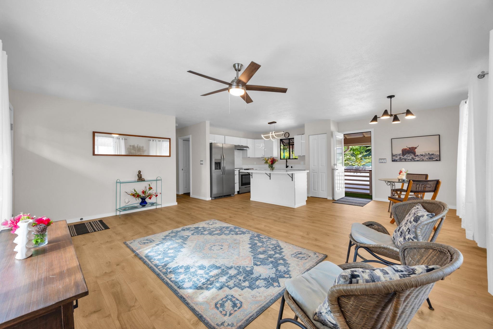 1702 Haiku Road, Unit B Haiku, HI 96708 - Photo 11 of 43 a living room with furniture and kitchen view