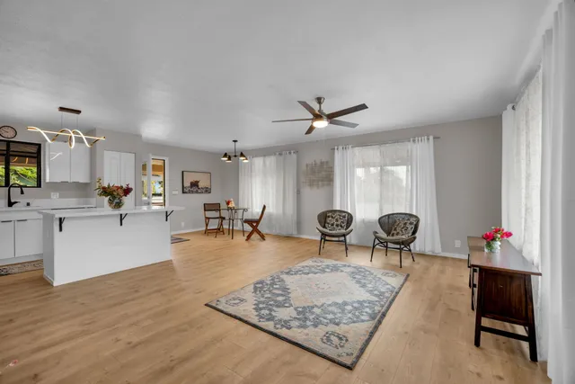 a living room with furniture and a table