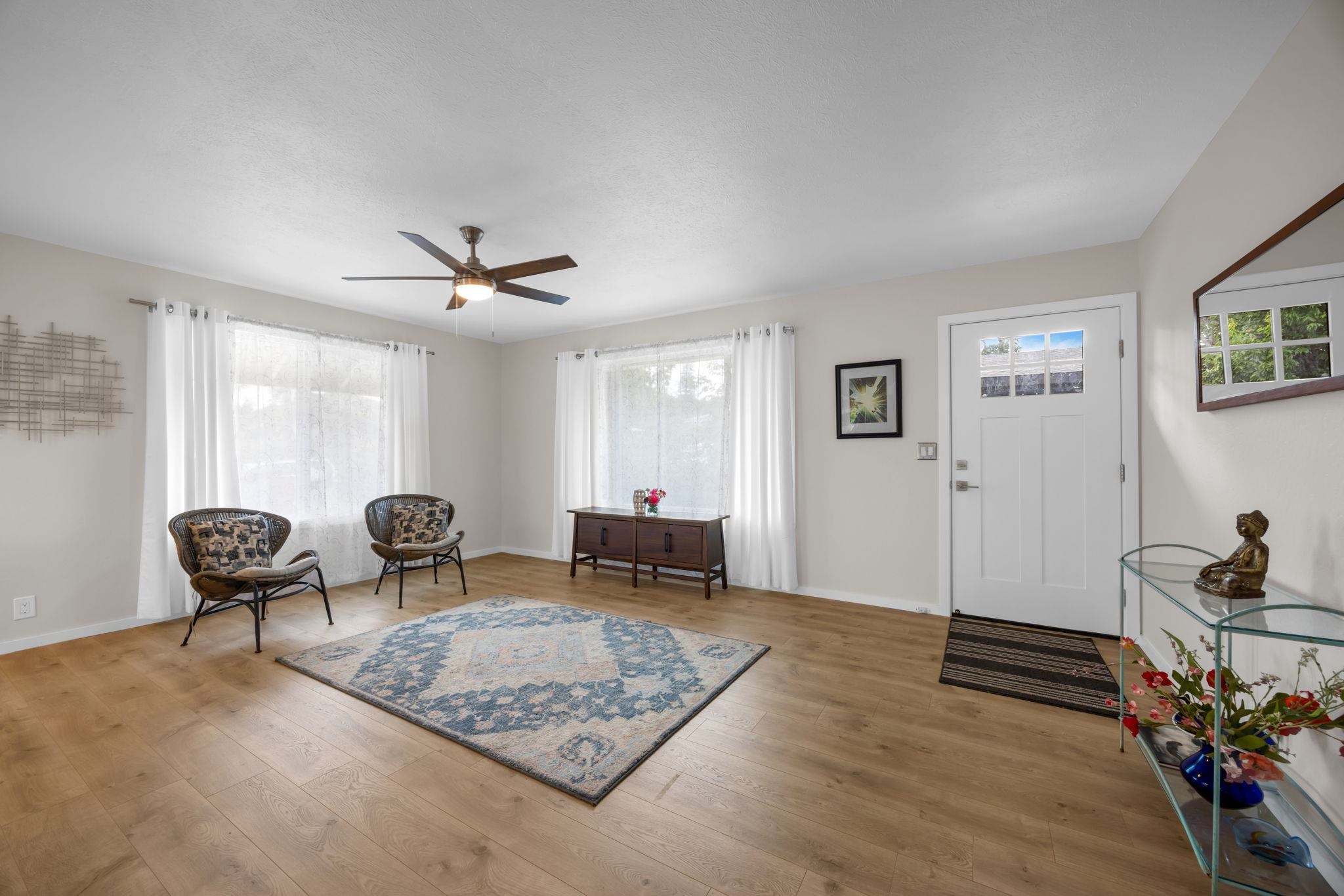 1702 Haiku Road, Unit B Haiku, HI 96708 - Photo 13 of 43 a living room with furniture rug and window