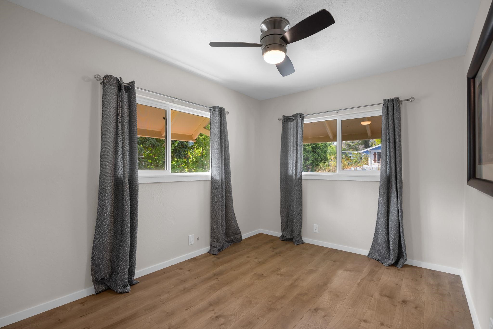 1702 Haiku Road, Unit B Haiku, HI 96708 - Photo 15 of 43 an empty room with window and stainless steel appliances