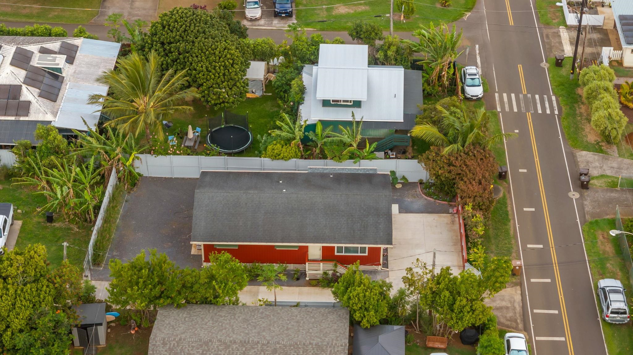 1702 Haiku Road, Unit B Haiku, HI 96708 - Photo 2 of 43 an aerial view of a house with a yard and large trees