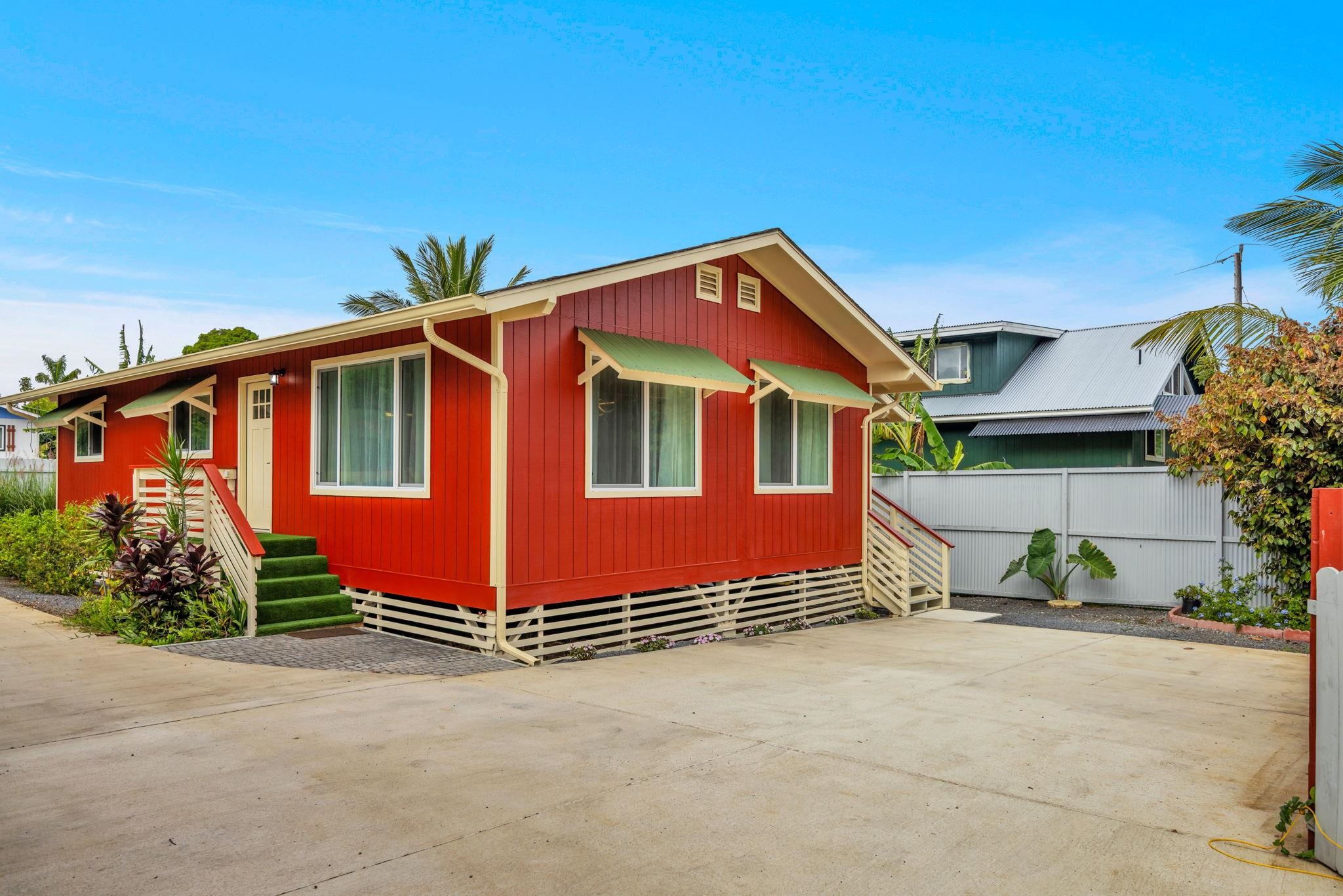 1702 Haiku Road, Unit B Haiku, HI 96708 - Photo 3 of 43 front view of a house with a yard