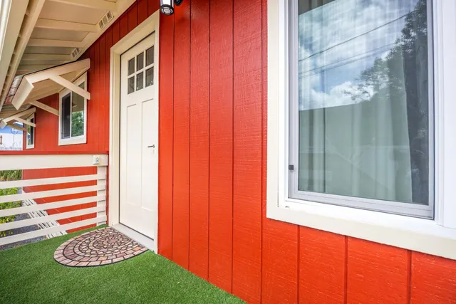 a view of a door and a yard