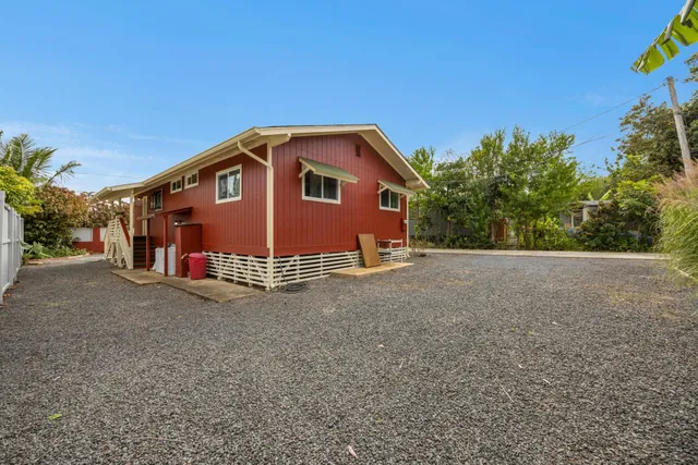 a view of a house with a yard and plant