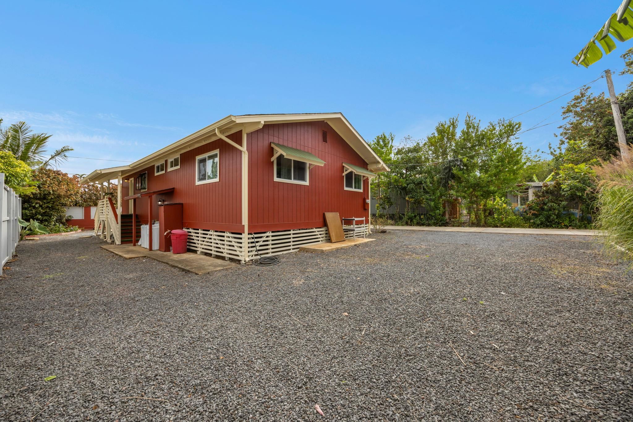 1702 Haiku Road, Unit B Haiku, HI 96708 - Photo 35 of 43 a view of a house with a yard and plant