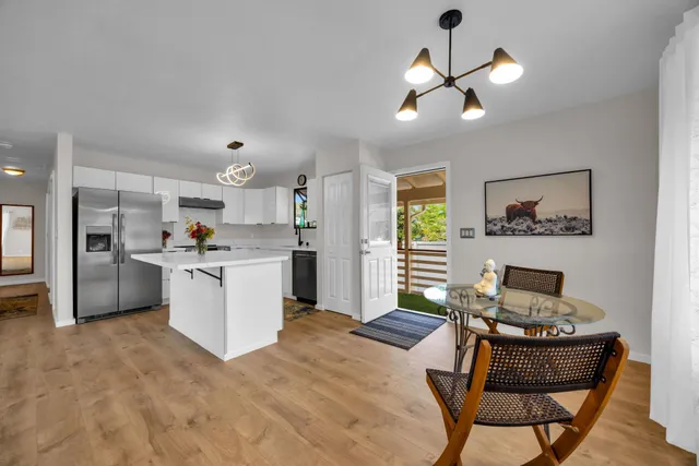 a kitchen with a refrigerator and a stove