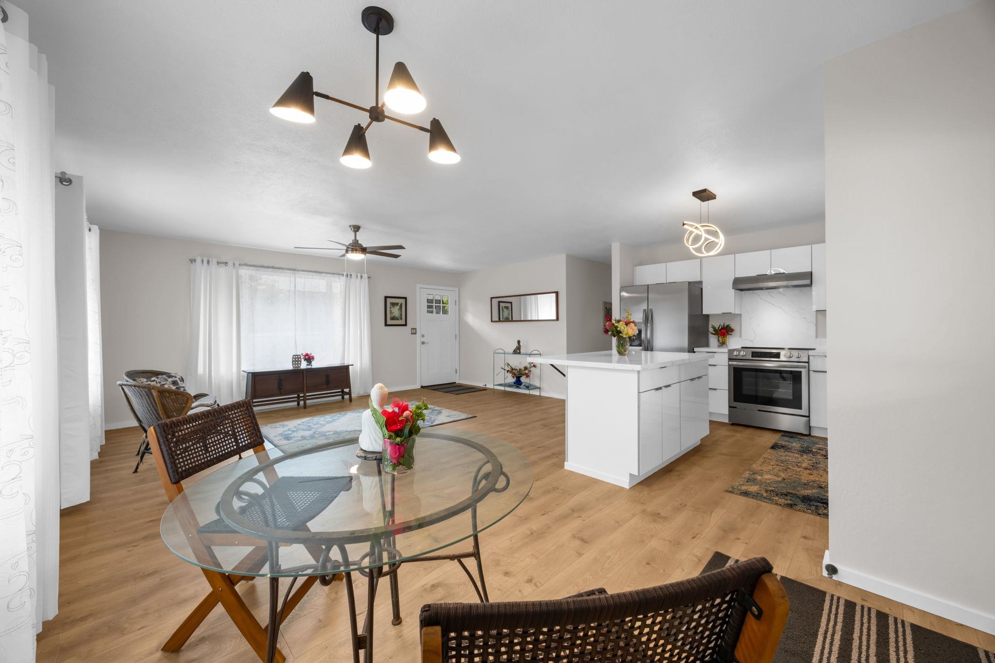 1702 Haiku Road, Unit B Haiku, HI 96708 - Photo 10 of 43 a living room with furniture and kitchen view