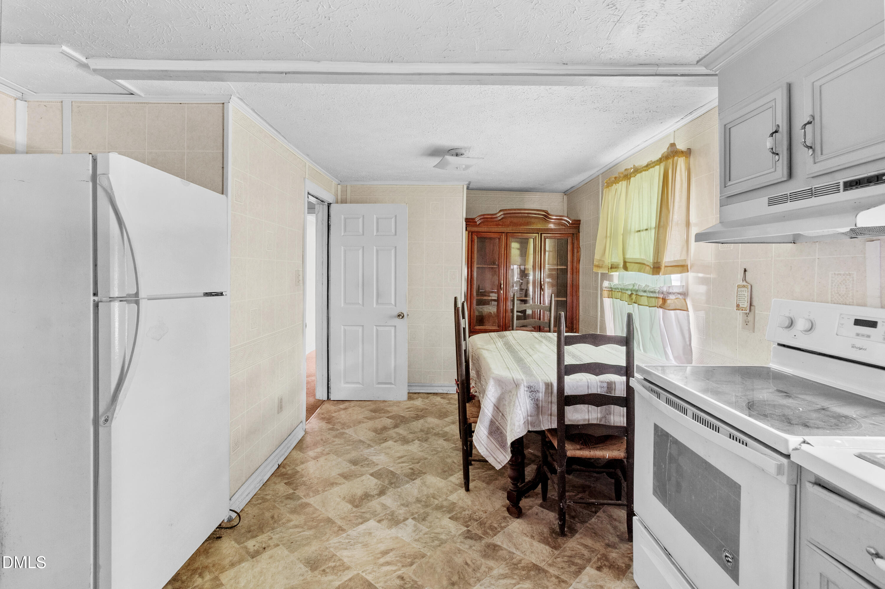 101 Doby Drive Raeford, NC 28376 - Photo 12 of 22 a view of a kitchen with refrigerator and workspace