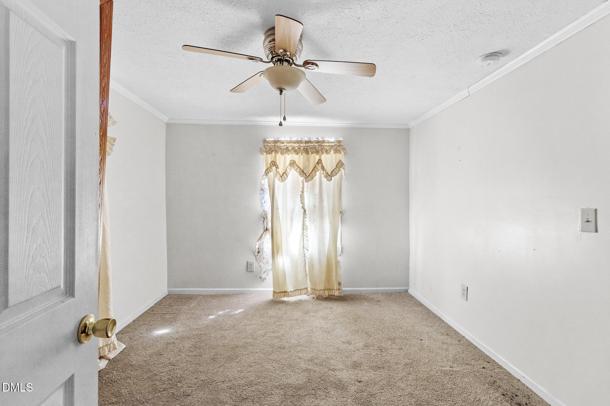101 Doby Drive Raeford, NC 28376 - Photo 14 of 22 an empty room with windows and fan