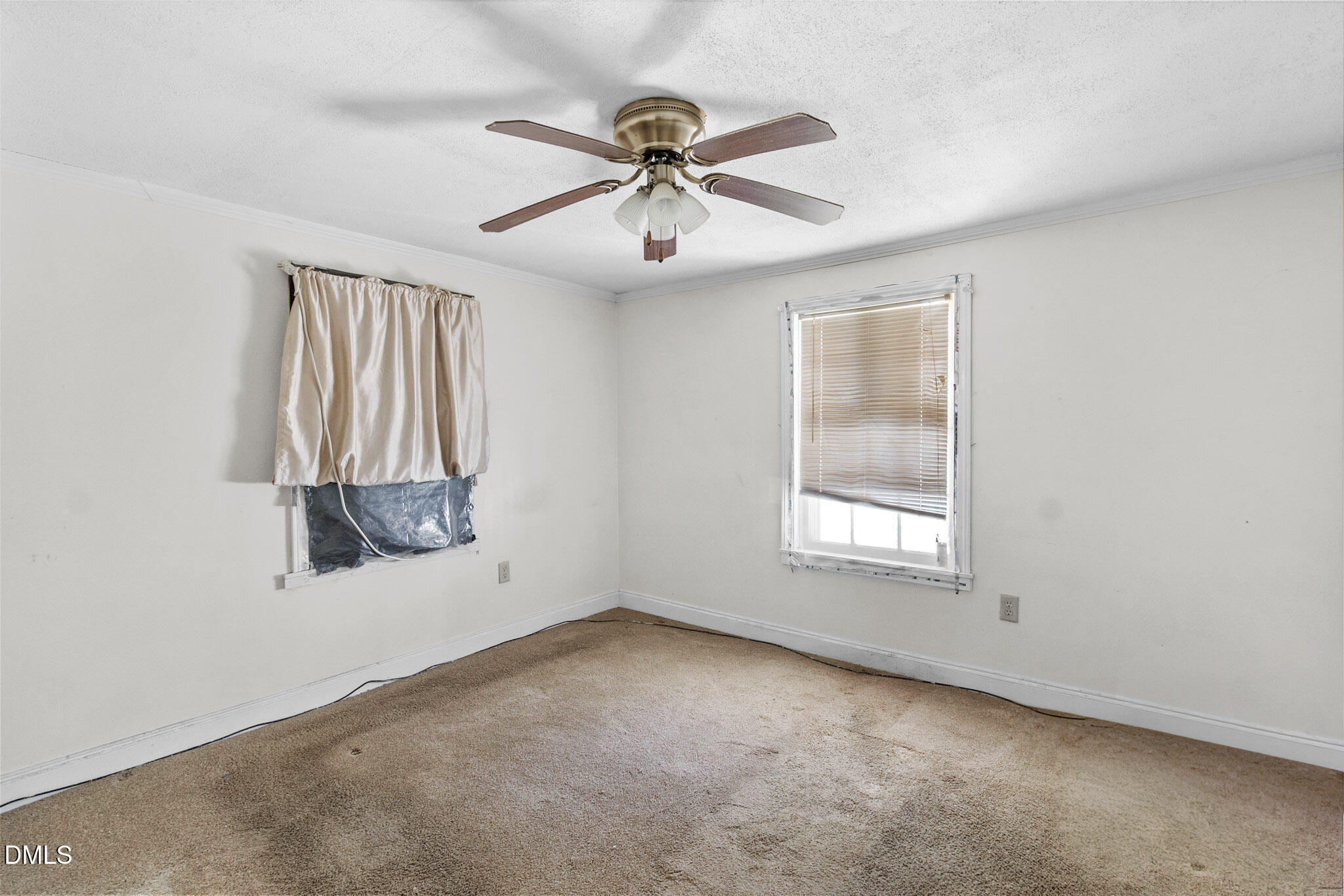 101 Doby Drive Raeford, NC 28376 - Photo 18 of 22 an empty room with a window and a fan