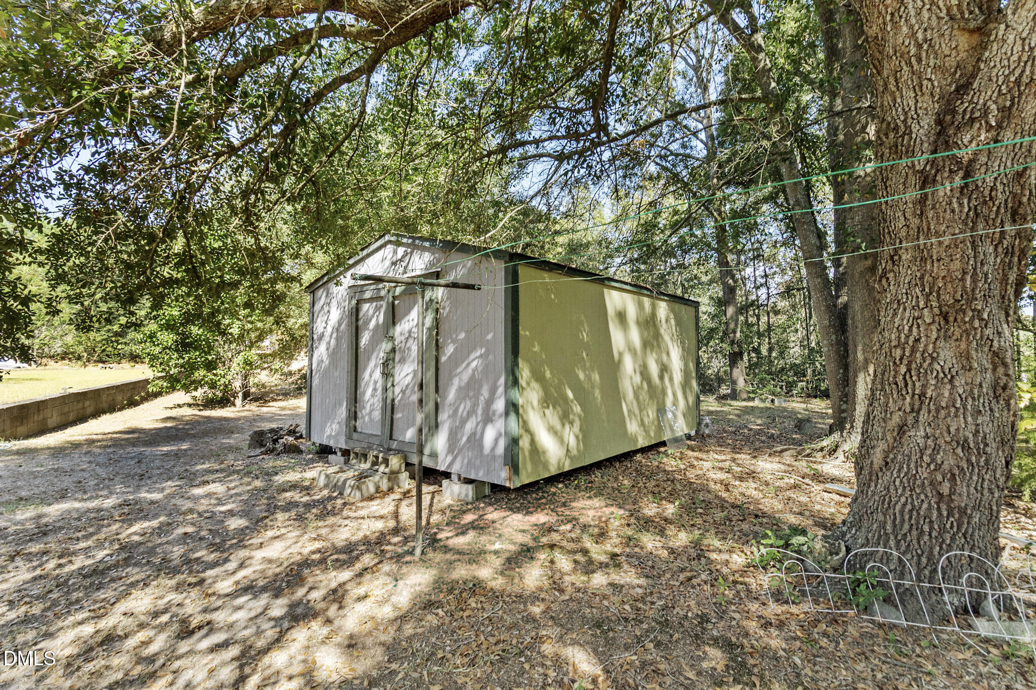 101 Doby Drive Raeford, NC 28376 - Photo 19 of 22 a view of a field with a tree in front of it