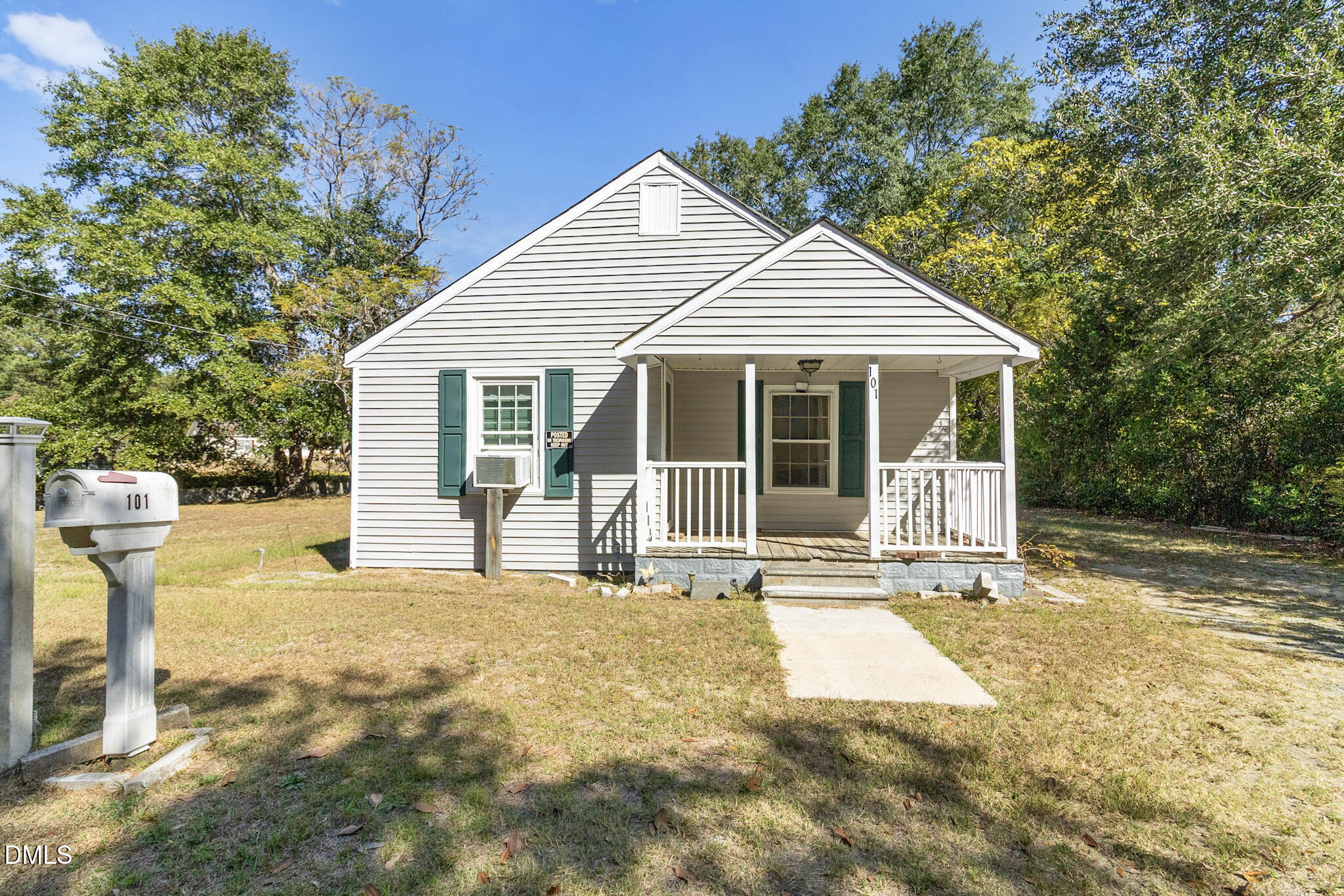 101 Doby Drive Raeford, NC 28376 - Photo 2 of 22 a front view of a house with a yard outdoor seating and garage