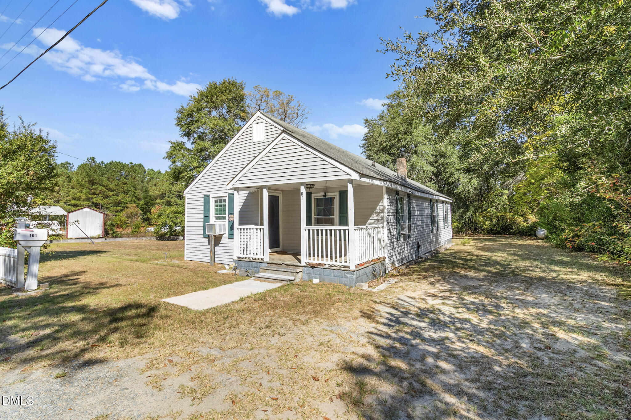 101 Doby Drive Raeford, NC 28376 - Photo 3 of 22 a front view of a house with a garden
