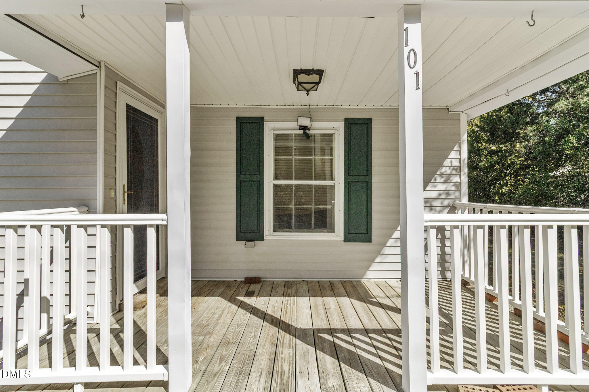 101 Doby Drive Raeford, NC 28376 - Photo 5 of 22 a view of balcony with a large window and wooden floor