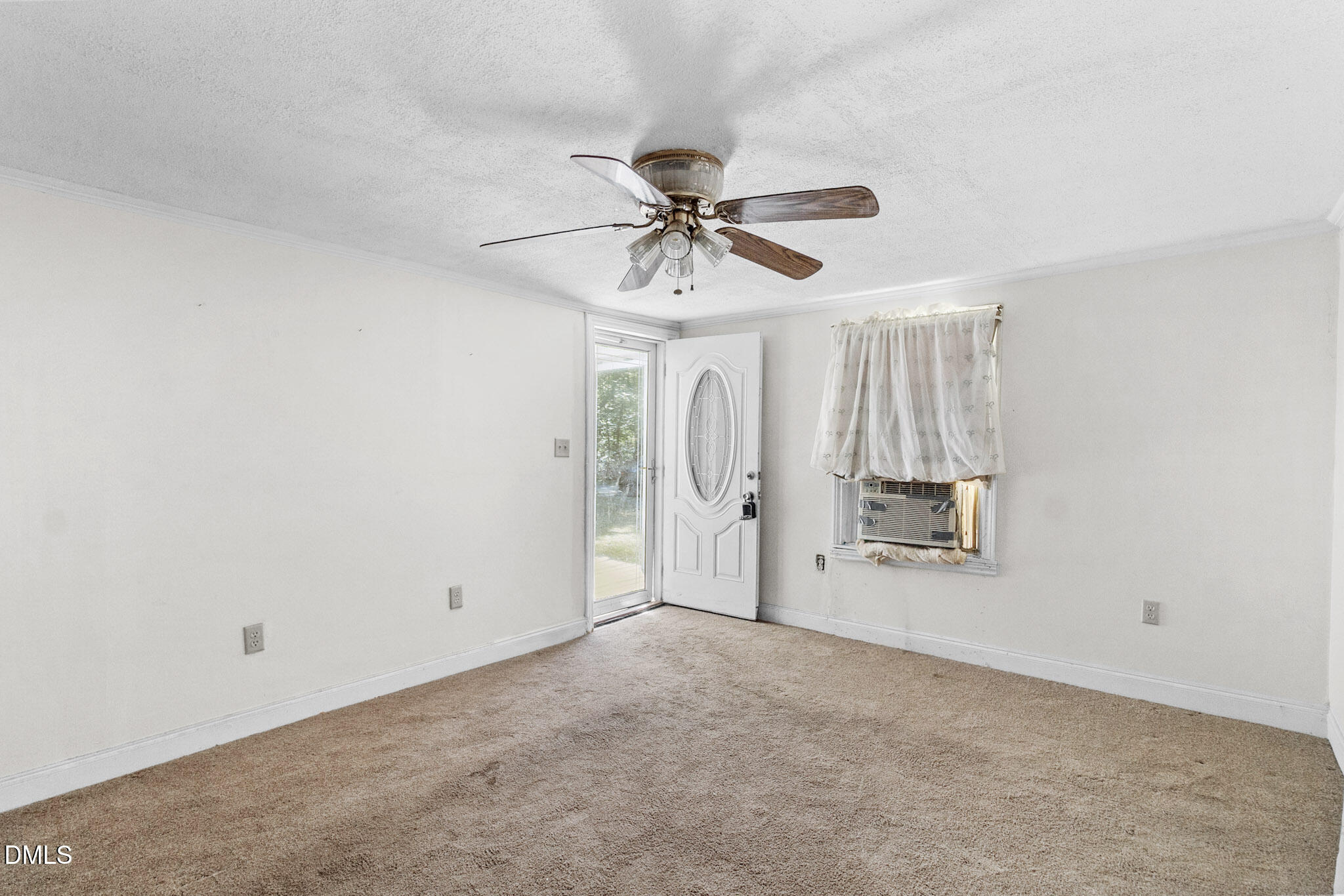 101 Doby Drive Raeford, NC 28376 - Photo 7 of 22 a view of a livingroom with a chandelier fan and window