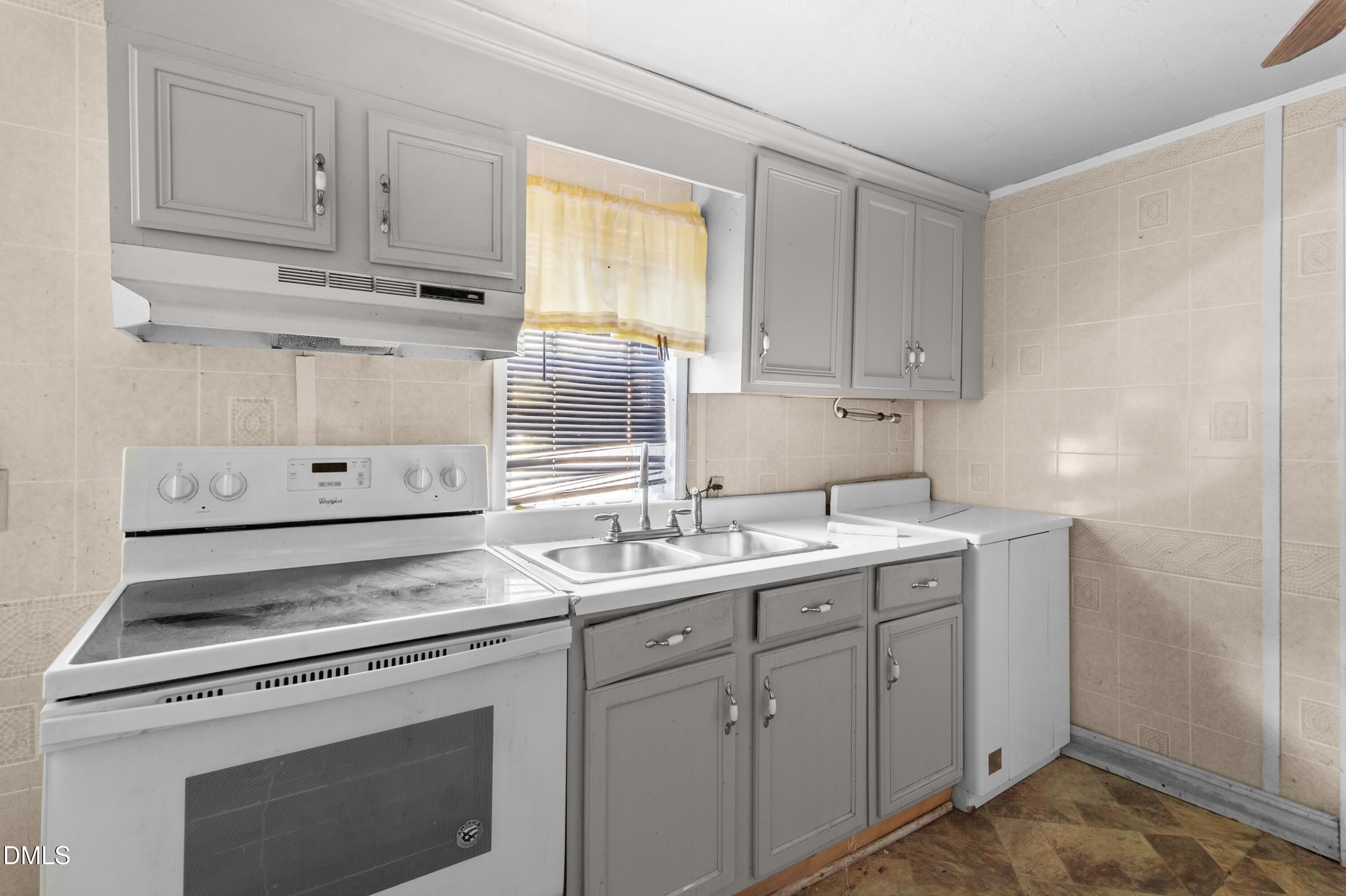 101 Doby Drive Raeford, NC 28376 - Photo 10 of 22 a kitchen with a sink stove and cabinets