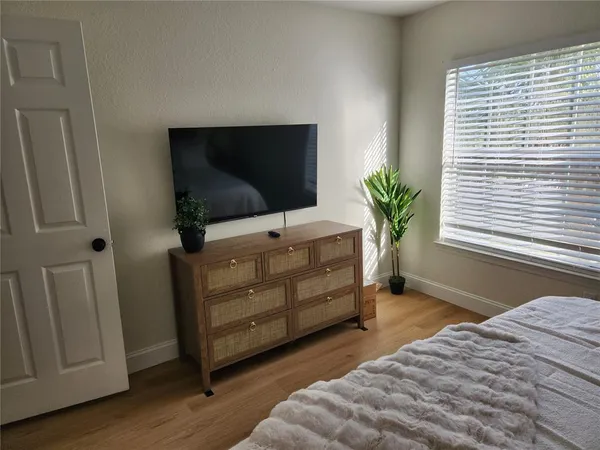 a room with furniture and flat screen tv