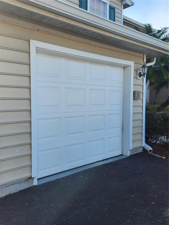 8926 Manor Loop, Unit 201B Lakewood Ranch, FL 34202 - Photo 26 of 32 a view of a house with a wooden floor and a window