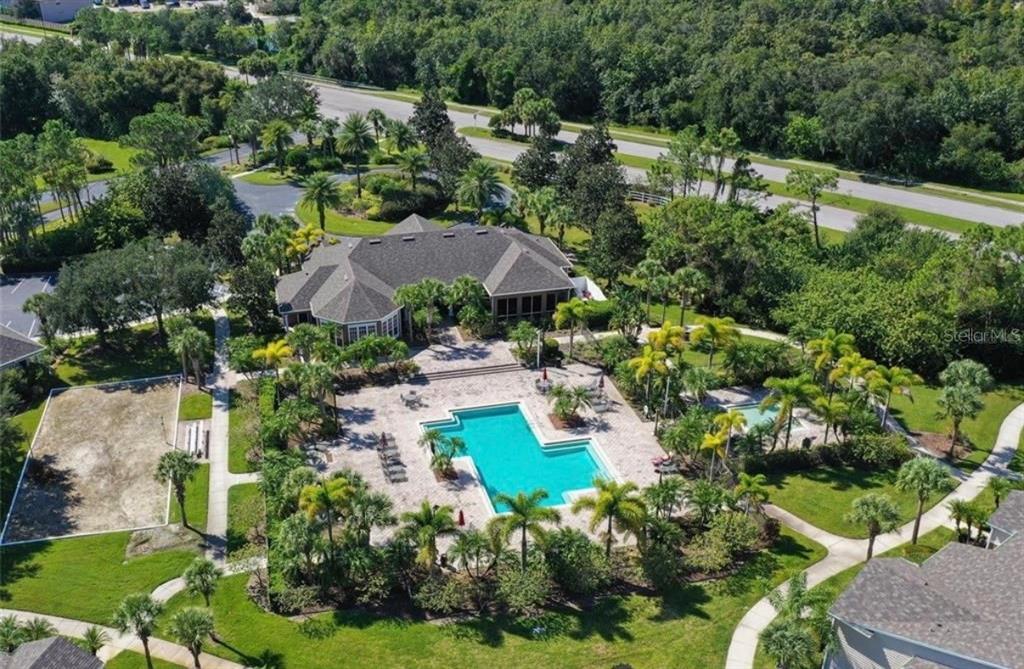 8926 Manor Loop, Unit 201B Lakewood Ranch, FL 34202 - Photo 27 of 32 an aerial view of house with swimming pool outdoor seating and yard