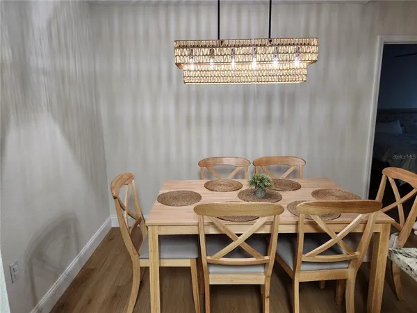 a view of a dining room with furniture and window