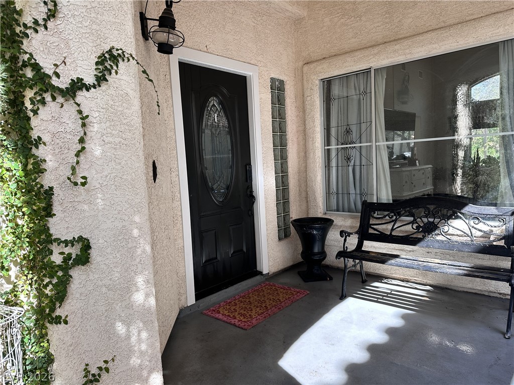9724 Trail Rider Drive Las Vegas, NV 89117 - Photo 12 of 52 View of exterior entry featuring stucco siding