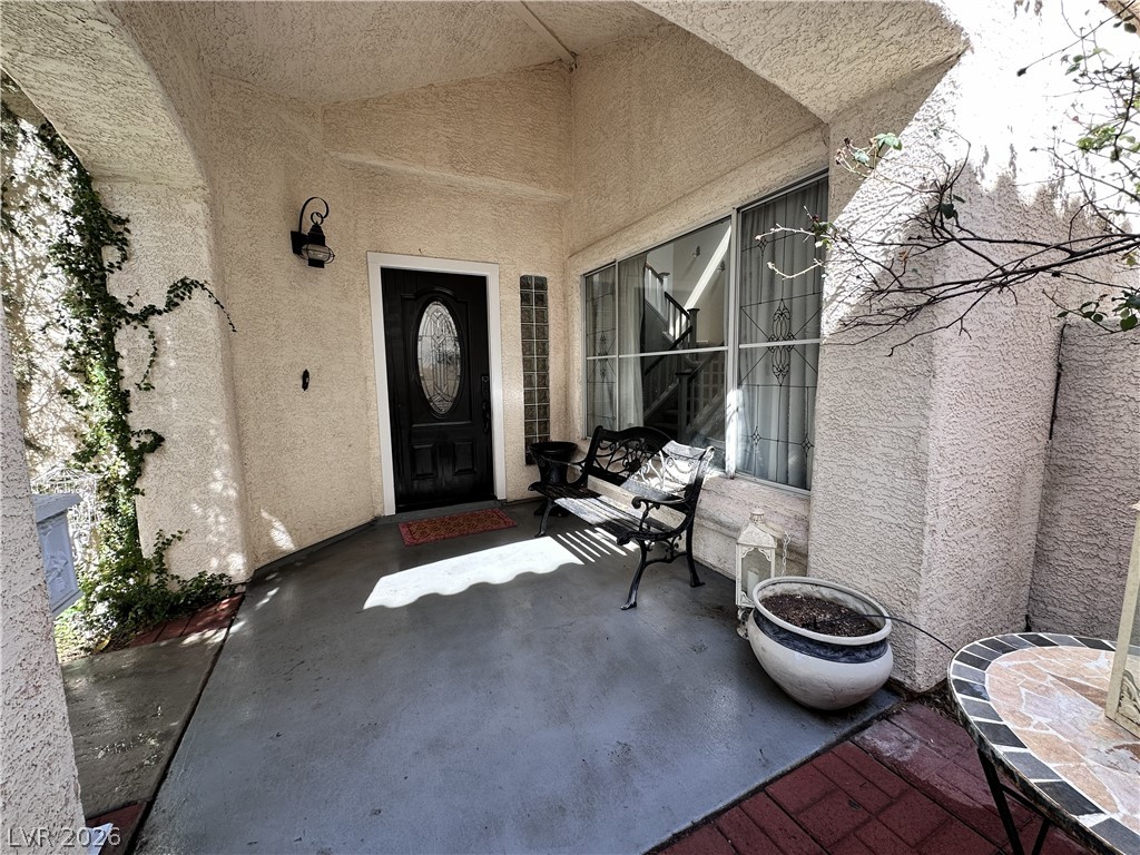 9724 Trail Rider Drive Las Vegas, NV 89117 - Photo 14 of 52 Entrance to property with stucco siding and a patio area