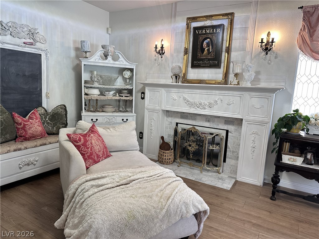 9724 Trail Rider Drive Las Vegas, NV 89117 - Photo 33 of 52 Bedroom with wood-type flooring and a fireplace with flush hearth