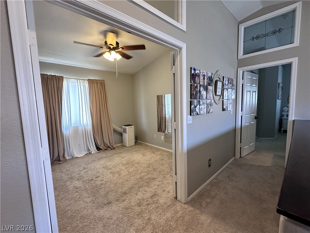9724 Trail Rider Drive Las Vegas, NV 89117 - Photo 45 of 52 Hall with vaulted ceiling and light colored carpet