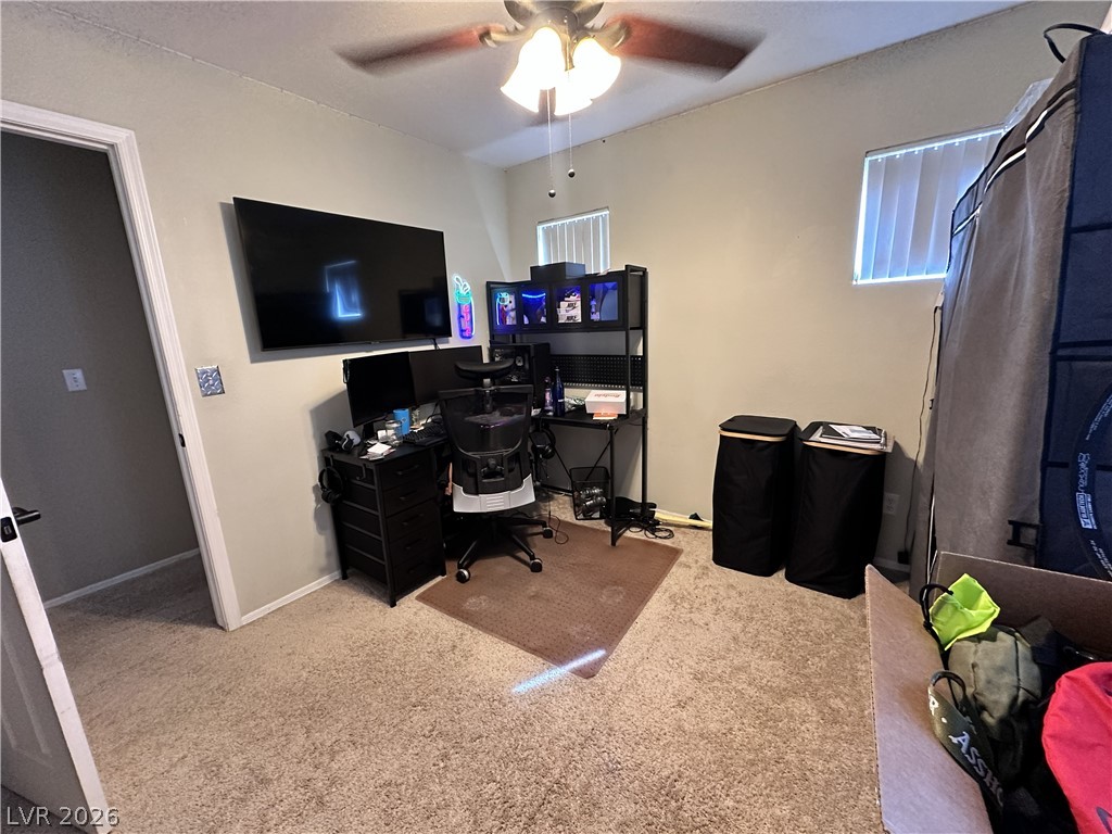 9724 Trail Rider Drive Las Vegas, NV 89117 - Photo 46 of 52 Office with light colored carpet and ceiling fan